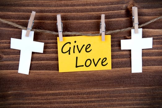 Yellow Banner with Give Love on a Line with Roods