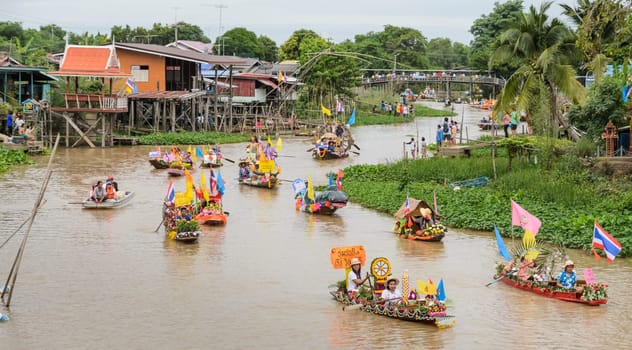 Traditional parading of candles to temple. Candle procession by the river ceremony on The Buddhist Lent Day in Ayutthaya, Thailand