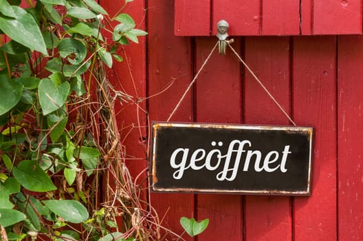 Old tin sign with inscription Open