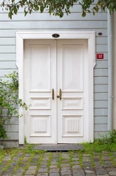 white front door of a wooden house in istanbul, turkey