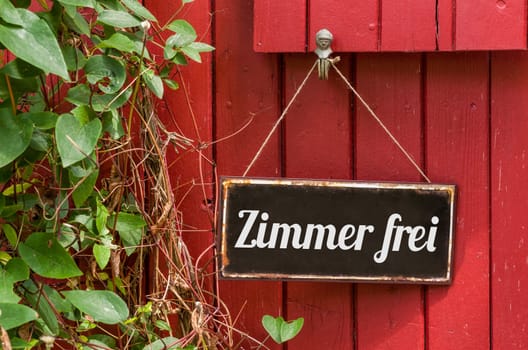 Old tin sign with inscription room free