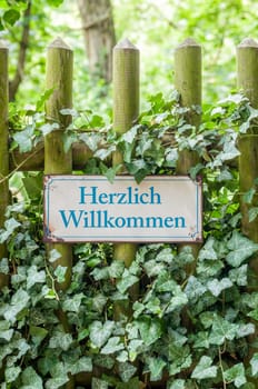 Old tin sign with inscription Welcome