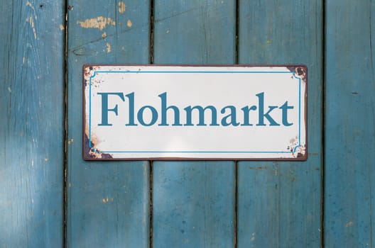 Old tin sign with inscription flea market