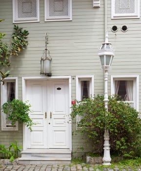 detail of a wooden house with lantern