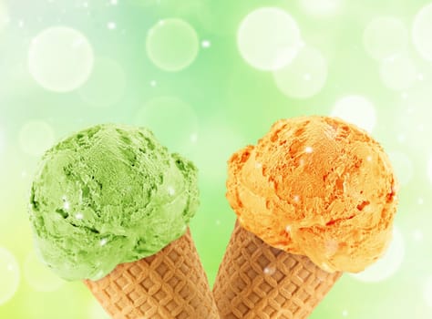 Kiwi and mango Ice cream in the cone with abstract light background.