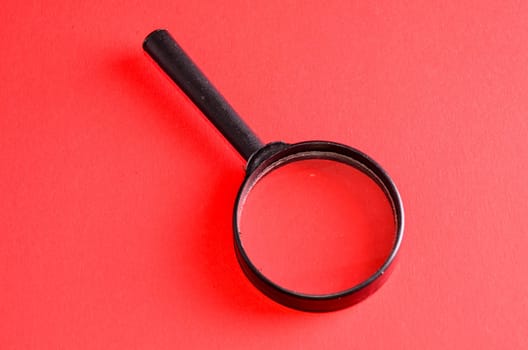 Vintage Magnify Glass Loupe on a Colored Background