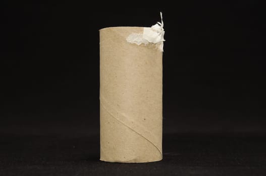 Empty Toilet Rolls Stack Up On a Black Background