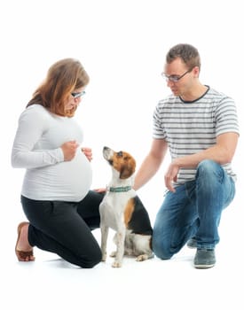 Expectant parents with dog