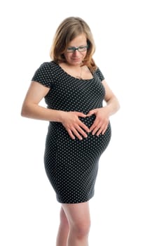 Pregnant woman forms a heart