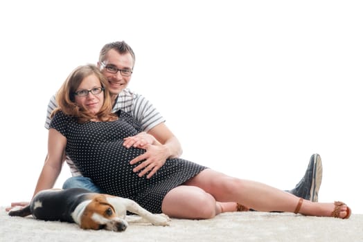 Expectant parents with dog