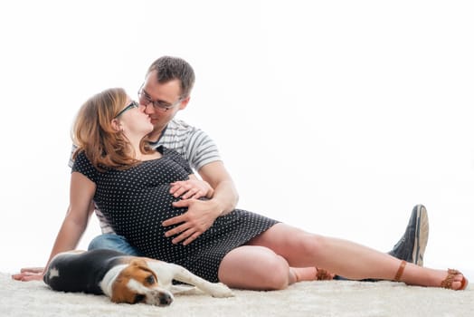 Expectant parents with dog