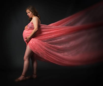 Pregnant woman in tulle dress