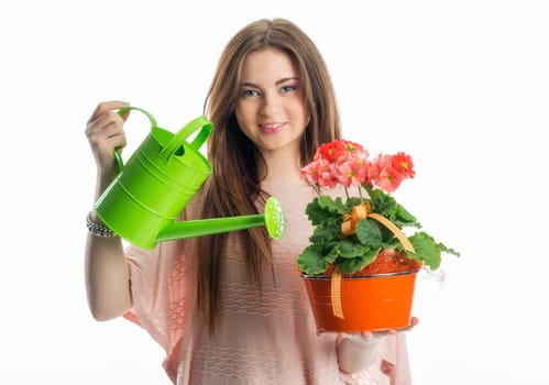 Girl with potted plant and watering can