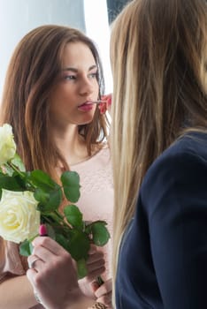 Make-up woman makes up a girl
