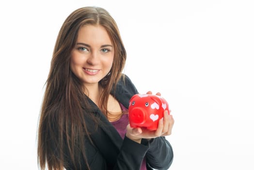 Young girl with piggy bank
