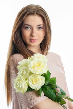 Young girl holds a bouquet of flowers