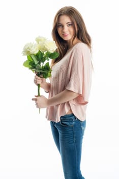Young girl holds a bouquet of flowers