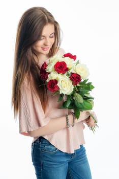 Young girl holds a bouquet of flowers
