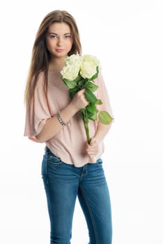 Young girl holds a bouquet of flowers