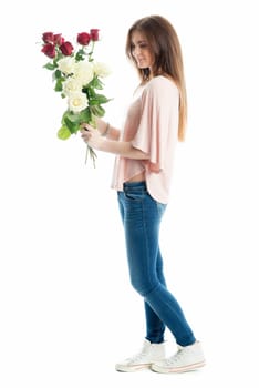 Young girl holds a bouquet of flowers