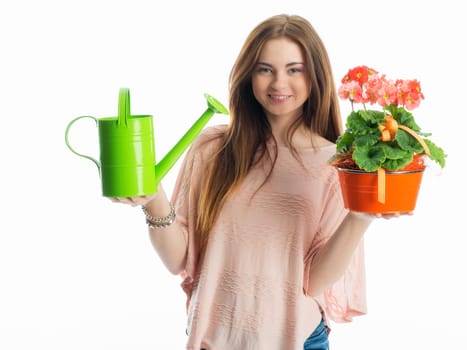 Girl with potted plant and watering can