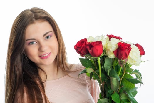 Young girl holds a bouquet of flowers