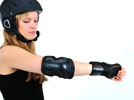 Girl with protectors and helmet