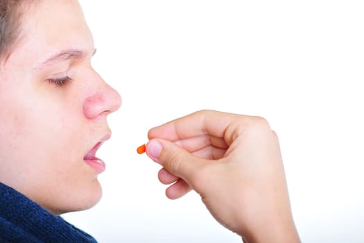 Young man takes medication