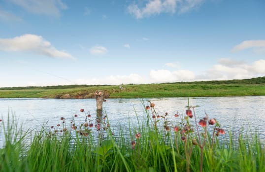 Man fishing for salmon in a beautiful surrounding