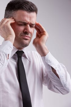 a man woith a severe headache suffering