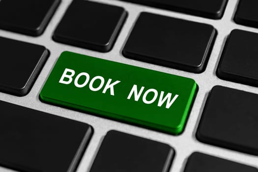 book now green button on keyboard, business concept