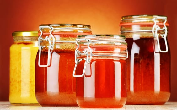 Composition with jars of honey.