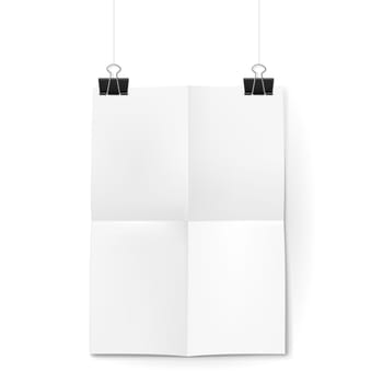White sheet of paper folded in four. The paper hangs on black binder clips.