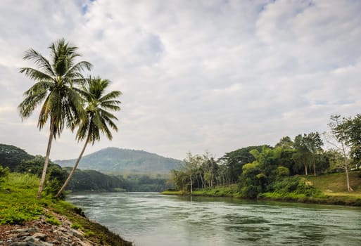 Tropical river landscape in cloudy day