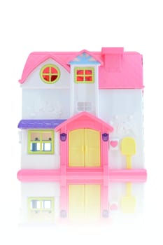 A close up shot of a toy doll house