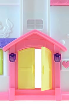 A close up shot of a toy doll house