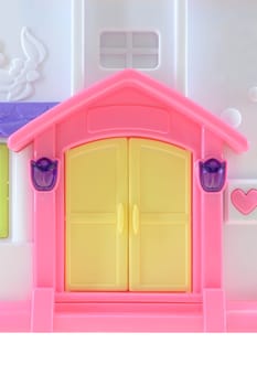 A close up shot of a toy doll house