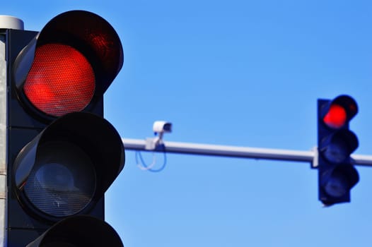 Traffic lights over blue sky