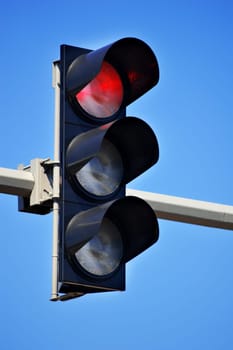 Traffic lights over blue sky
