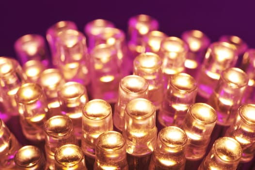 Macrodetail of some warm white LEDs in violet light