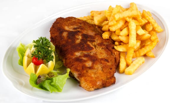 Schnitzel with fries and salad