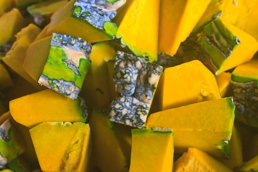 Slices of fresh pumpkins for cooking - ripe cut pumpkins