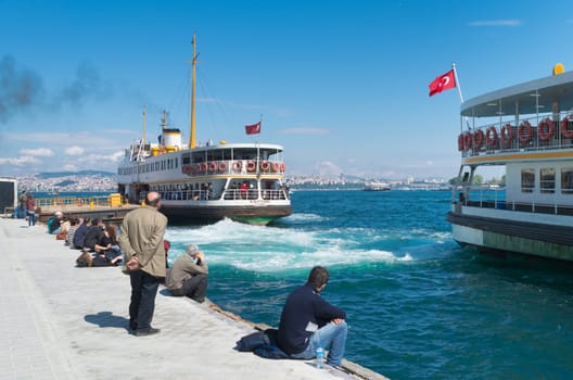 Ferry boat leaving Karakoy pier in Istanbul. Nearly 150,000 passengers use ferries daily in Istanbul, due to easy access to two different continents.