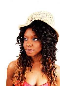 A young Jamaican women in a portrait picture with long black and blond.hair wearing a straw hat, isolated for white background..