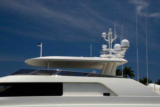 yacht,ship,boat,side,side,close up,close,dense,white,window,antenna,radar,black,protection,sunscreen,sky,blue