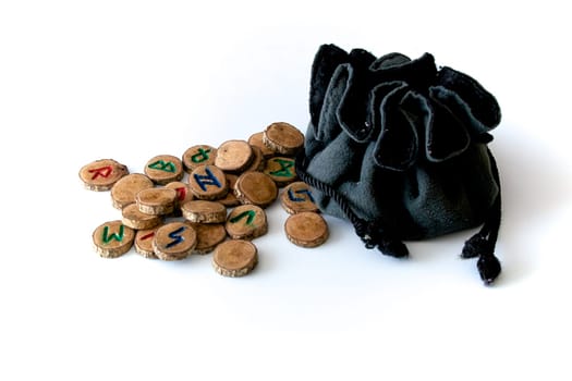 Set of oak runes, an ancient alphabet known as the futhark on white with draw string pouch..Note