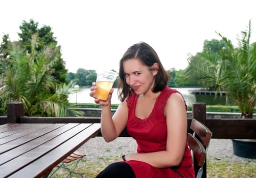 Woman drinks beer