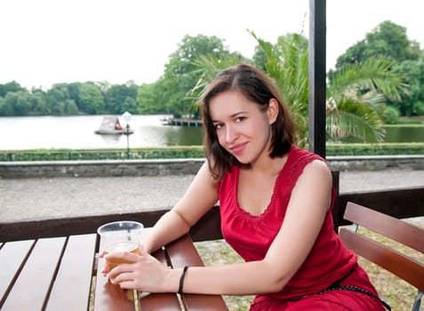 Woman drinks beer