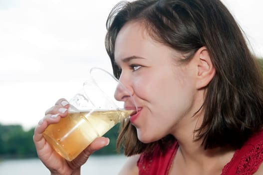 Woman drinks beer