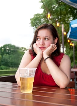 sad woman with beer